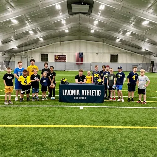 Teams lined up on the indoor turf field